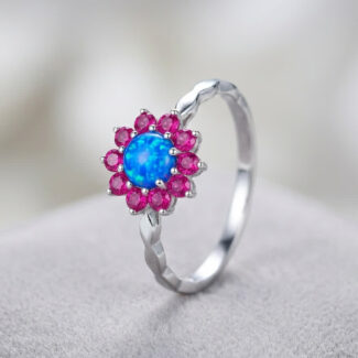 blue opal with ruby stone ring